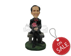 Custom Bobblehead Sophisticated Smart Man Sitting In Formal Dress With Legs Folded And Hands Wrapped Around A Bouquet - Leisure & Casual Casual Males Personalized Bobblehead & Cake Topper