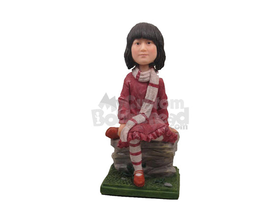 Custom Bobblehead Cute Girl In Winter Dress Sitting On A Rock With One Leg Folded And Scarf Around Her Neck - Leisure & Casual Casual Females Personalized Bobblehead & Cake Topper