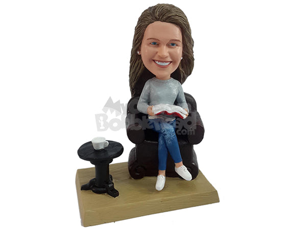 Custom Bobblehead Smart looking gal relaxed on a confy couch and reading a nice book with a nice coffee next to her - Leisure & Casual Casual Females Personalized Bobblehead & Action Figure