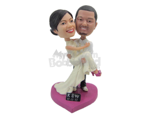 Custom Bobblehead Groom Carrying The Bride In His Arms Wearing Gorgeous Wedding Outfit - Wedding & Couples Bride & Groom Personalized Bobblehead & Cake Topper