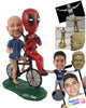 Custom Bobblehead Funny looking couple riding with his favorite action hero on the bycicle - Wedding & Couples Couple Personalized Bobblehead & Action Figure