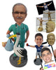 Custom Bobblehead Gynecologist Doctor In Medical Attire And Stork Holding A Newborn Baby - Careers & Professionals Medical Doctors Personalized Bobblehead & Cake Topper