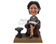 Custom Bobblehead Lady Wearing Jacket Sitting On A Couch Reading A Book And Having A Cup Of Tea - Careers & Professionals Teachers Personalized Bobblehead & Cake Topper