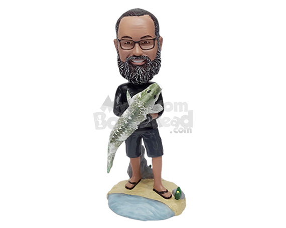 Custom Bobblehead Relaxed fisherman holding his big fish and wearing a long sleeve t-shirt, shorts and flipflops - Sports & Hobbies Fishing Personalized Bobblehead & Action Figure