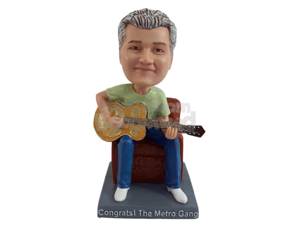 Custom Bobblehead Male playing a banjo like guitar sitting on a chair wearing a round neck t-shirt - Musicians & Arts Strings Instruments Personalized Bobblehead & Action Figure