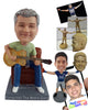 Custom Bobblehead Male playing a banjo like guitar sitting on a chair wearing a round neck t-shirt - Musicians & Arts Strings Instruments Personalized Bobblehead & Action Figure
